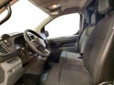 a view of the inside of a truck from the driver ' s seat