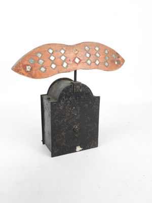 a small metal object that is on top of a book