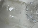 two empty wine glasses sitting on a white table