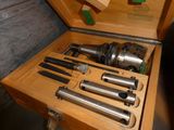 a wooden box with a bunch of tools inside of it