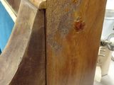 a close up of a mirror with a wooden frame