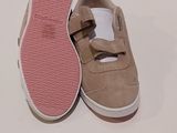 pair of todd ' s shoes with pink soles on a white surface