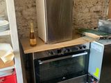 an image of a kitchen with a stove and a refrigerator