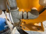 a close up of a pipe with a blue cap on it