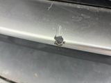 a piece of metal that has been left on the front of a car