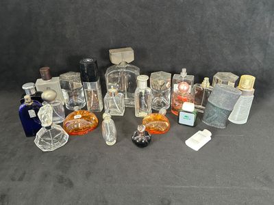 many bottles of perfume on a black surface