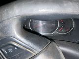 a close up of a car dashboard with a steering wheel