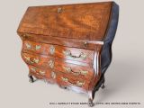 a small wooden desk with many drawers and drawers on it