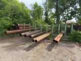 a lot of pipes that are sitting in the dirt