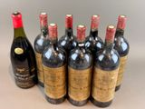 six bottles of wine are lined up in a row on a table