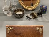 several different types of antique items are displayed on a table