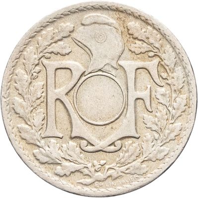 une vieille pièce sur laquelle est inscrit le mot « roh »