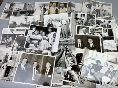 several black and white photos of people and their families on a table