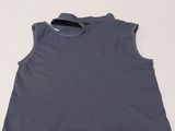 the top of a gray shirt is on a white surface