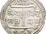 a close up of a silver coin on a white background