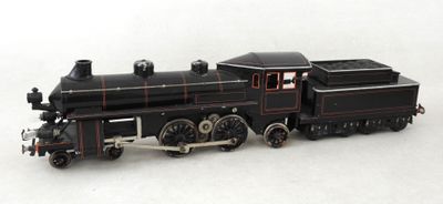 un petit train posé sur une surface blanche