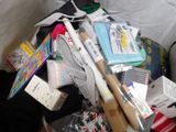 a pile of assorted items sitting on a bed