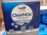a bottle of clearnox sitting on top of a stack of blue containers