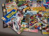 a lot of comic books sitting on a table
