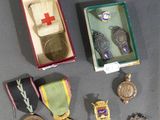 a small box with medals and other items in it