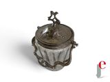 an image of a silver container with a bird on top of it