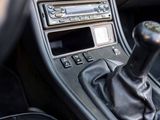 a close up of a car ' s dashboard with a gear stick