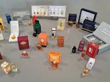 many different types of perfumes displayed on a table
