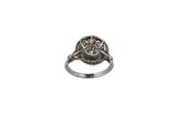 an image of a silver ring with a diamond in the center