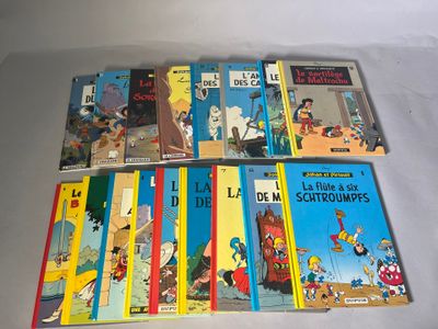 plusieurs livres pour enfants sont alignés sur une surface blanche