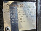 a close up of a metal plate with a name tag on it