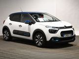 the white citrole is parked in front of a white wall