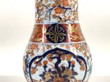 a vase that is sitting on a white surface
