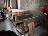 several pieces of wood are stacked on top of each other in a room