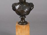 bronze bust of a man on a marble base