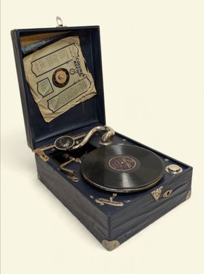 an old record player in a case with a key