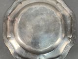 a silver plate that is sitting on a table