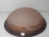 a brown and white bowl on a white surface