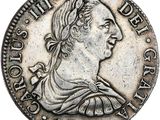 une pièce en argent avec l'image d'une femme de profil