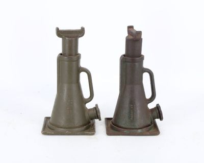two metal objects that are sitting on a white surface