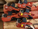 several chainsaws that are sitting on a pallet