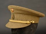 a hat with a button on it on a mannequin head
