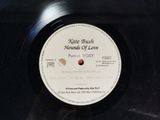 the record is on a black surface with a white label