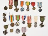 an image of a collection of medals and medals on a white surface