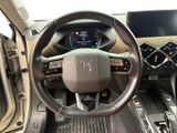 the interior of a car with a steering wheel and dashboard controls