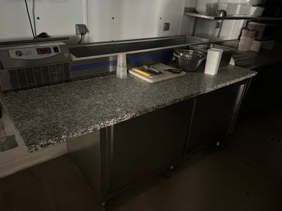 an image of a kitchen with stainless steel appliances and granite counter tops