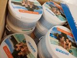 a cardboard box filled with several containers of waterbalt