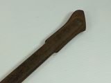 an old rusty hammer on a white surface