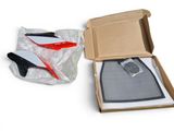 a box with a pair of scissors in it and a pair of scissors in the box