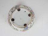 a white plate with a flower design on it