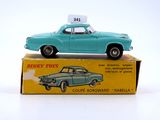 a blue toy car sitting on top of a box
